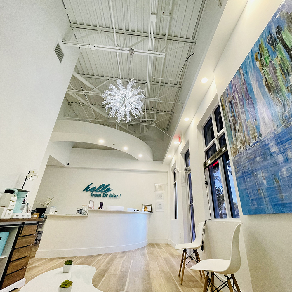 The image shows an interior space, likely a reception area or waiting room of a business with a modern design.